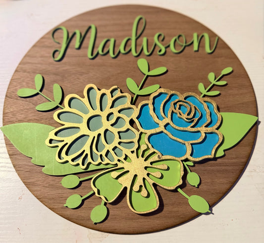 Customized name sign with flowers.